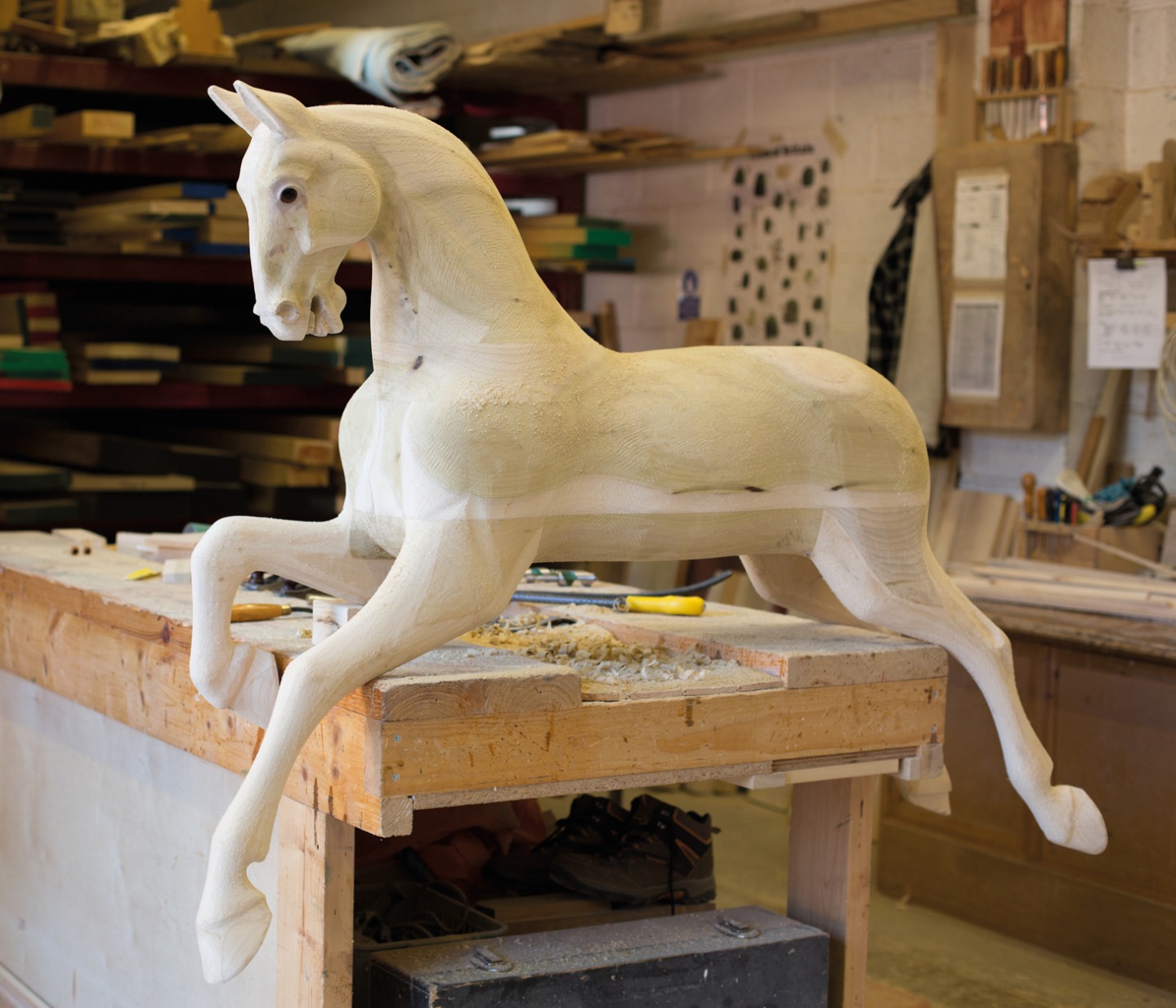 Bare wood carved wooden rocking horse 