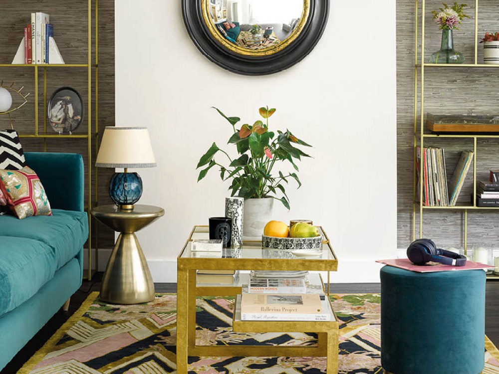 Living area decorated with blue hues and brass