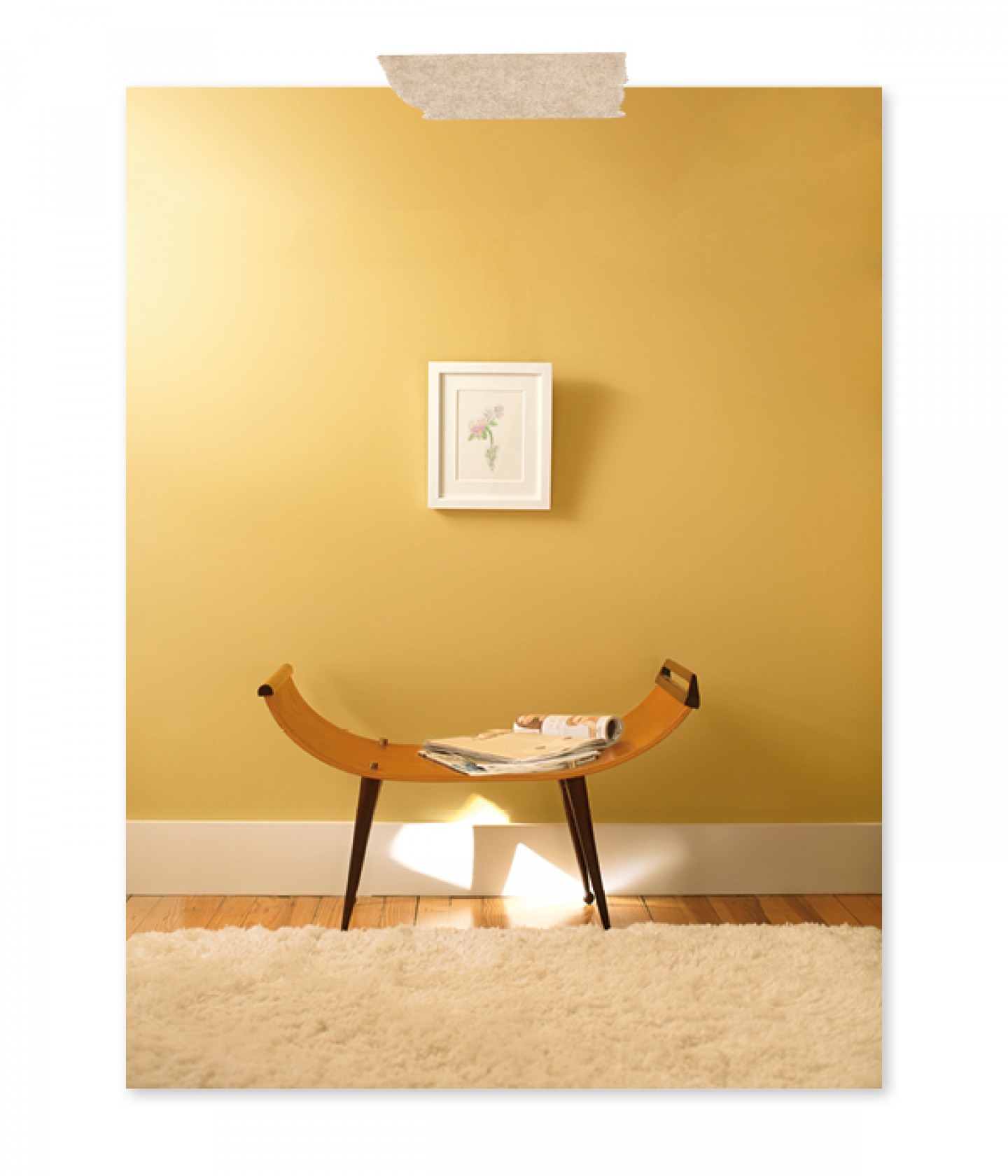 wooden seat with a yellow wall behind