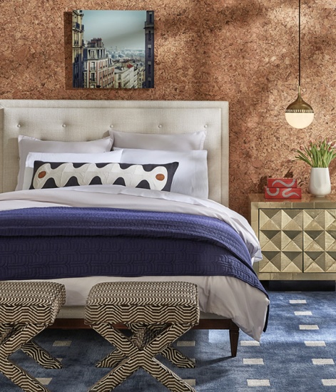 Bedroom decorated with a cork feature wall