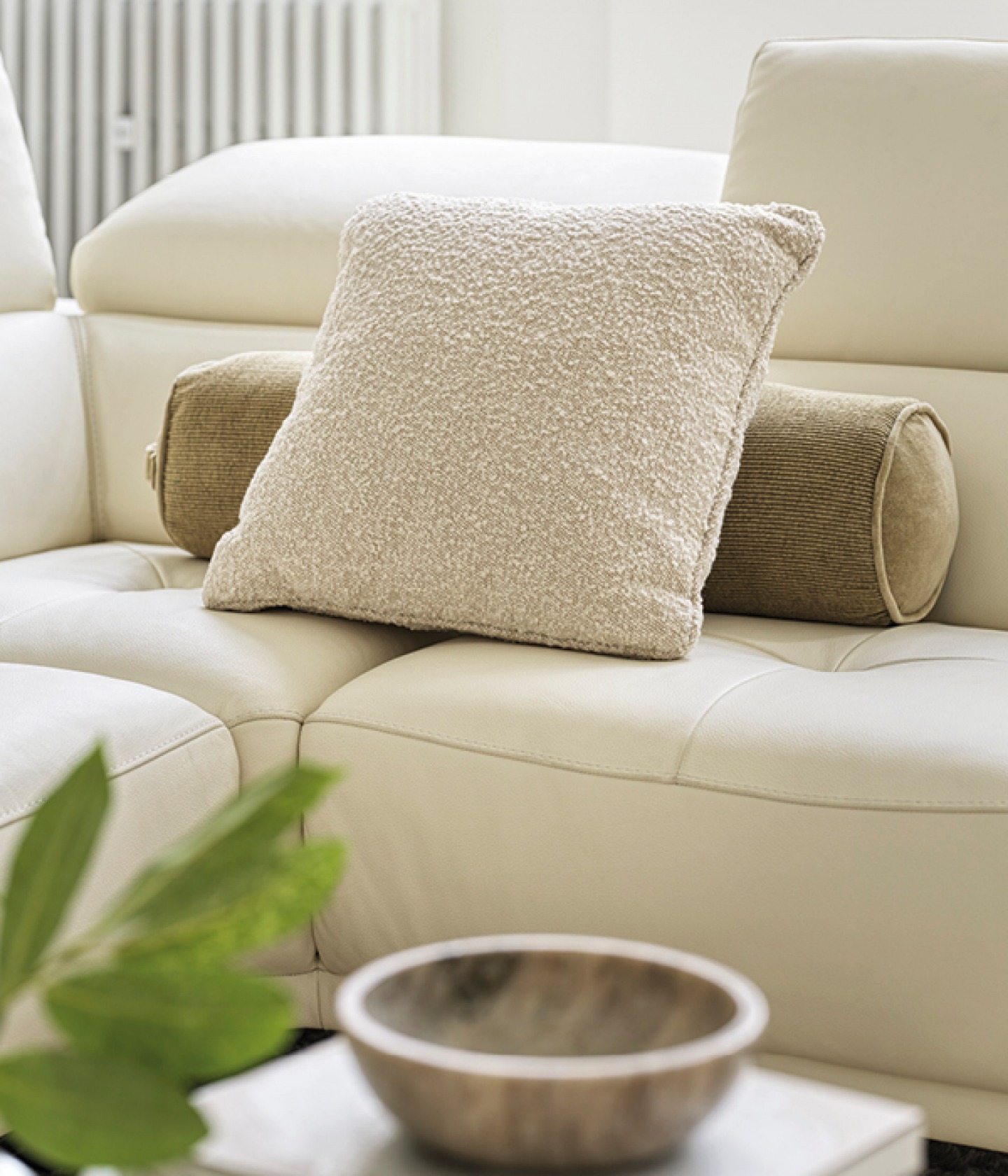 Cream and brown cushions on cream sofa