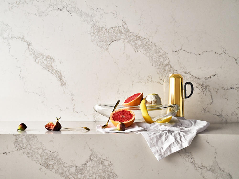 marble surface and back splash with fruit and glass dish