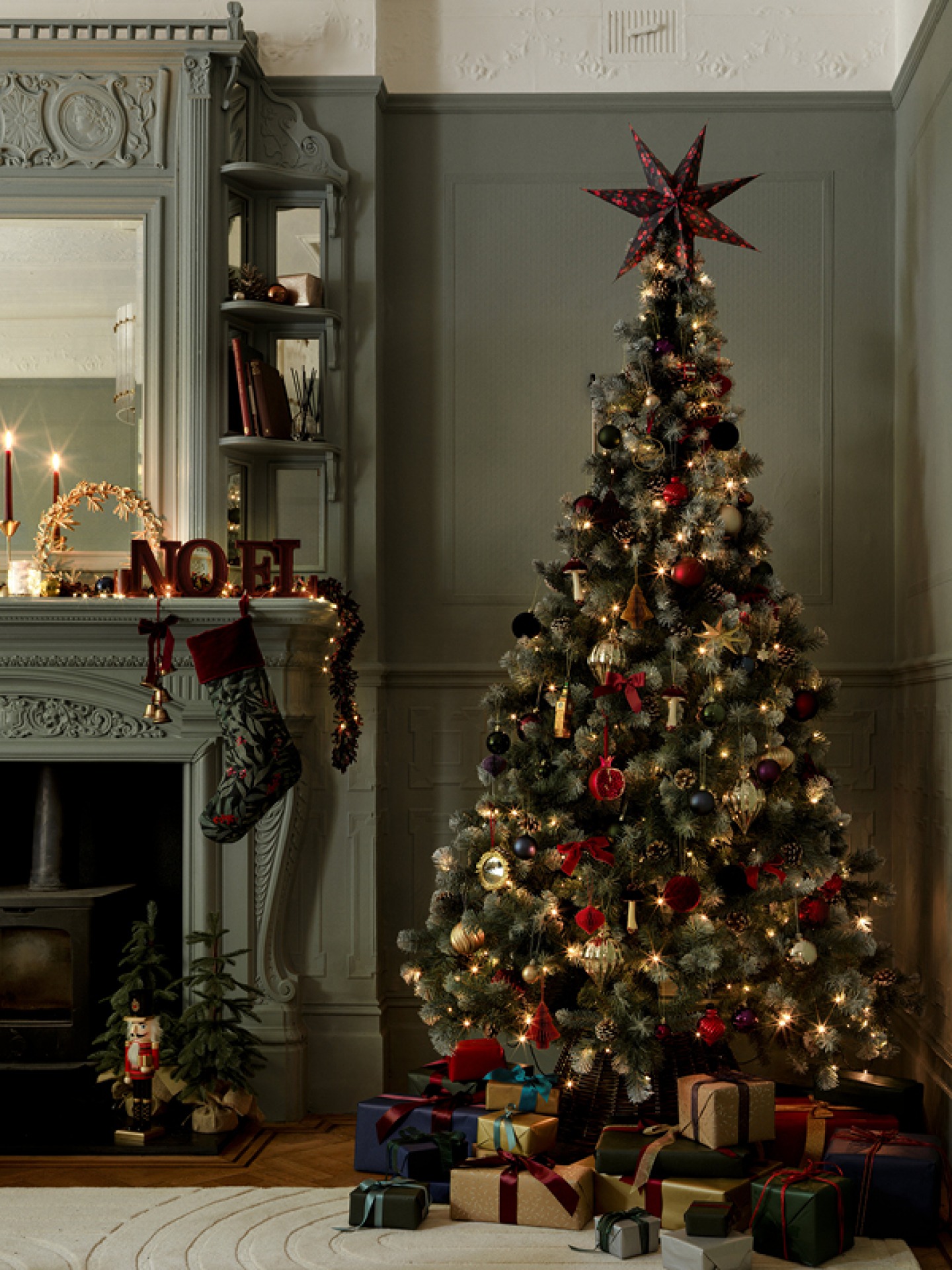 Decorated Christmas tree with greens reds and golds. Habitat