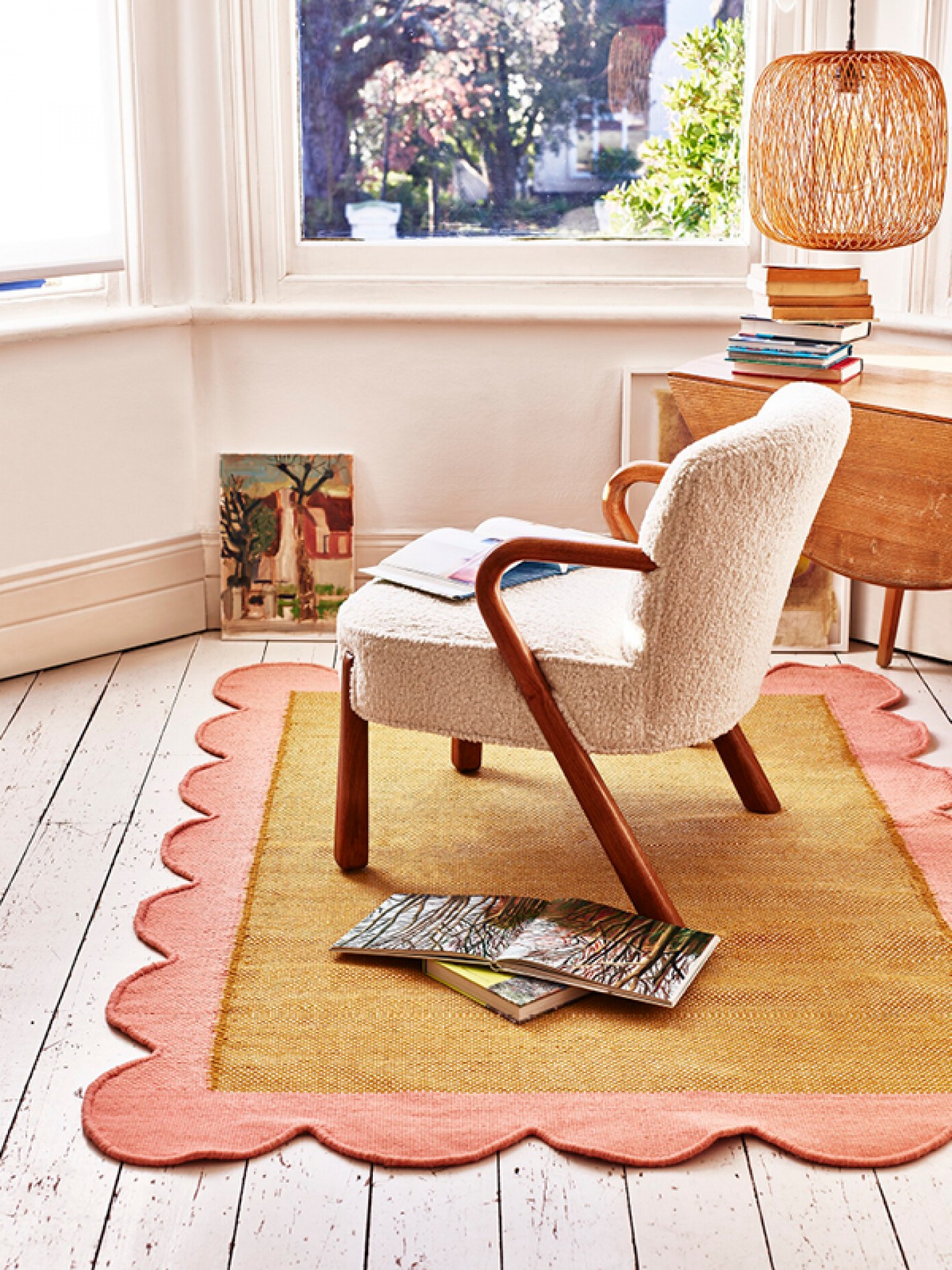 Oliver Bonas Room set with bright rug and armchair