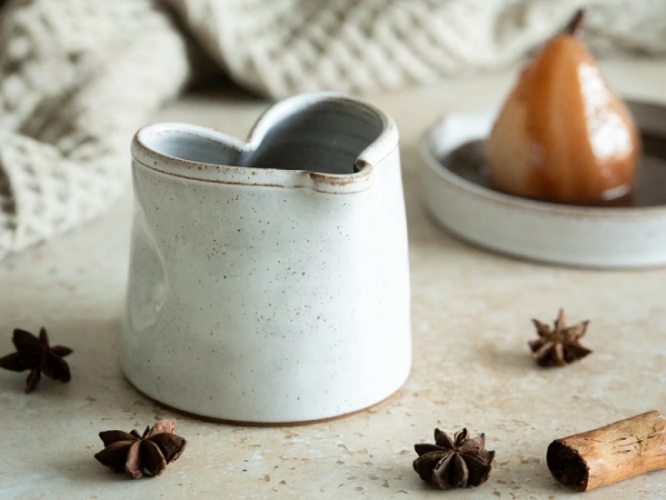 Off white, speckled Ceramic jug with a heart shaped top