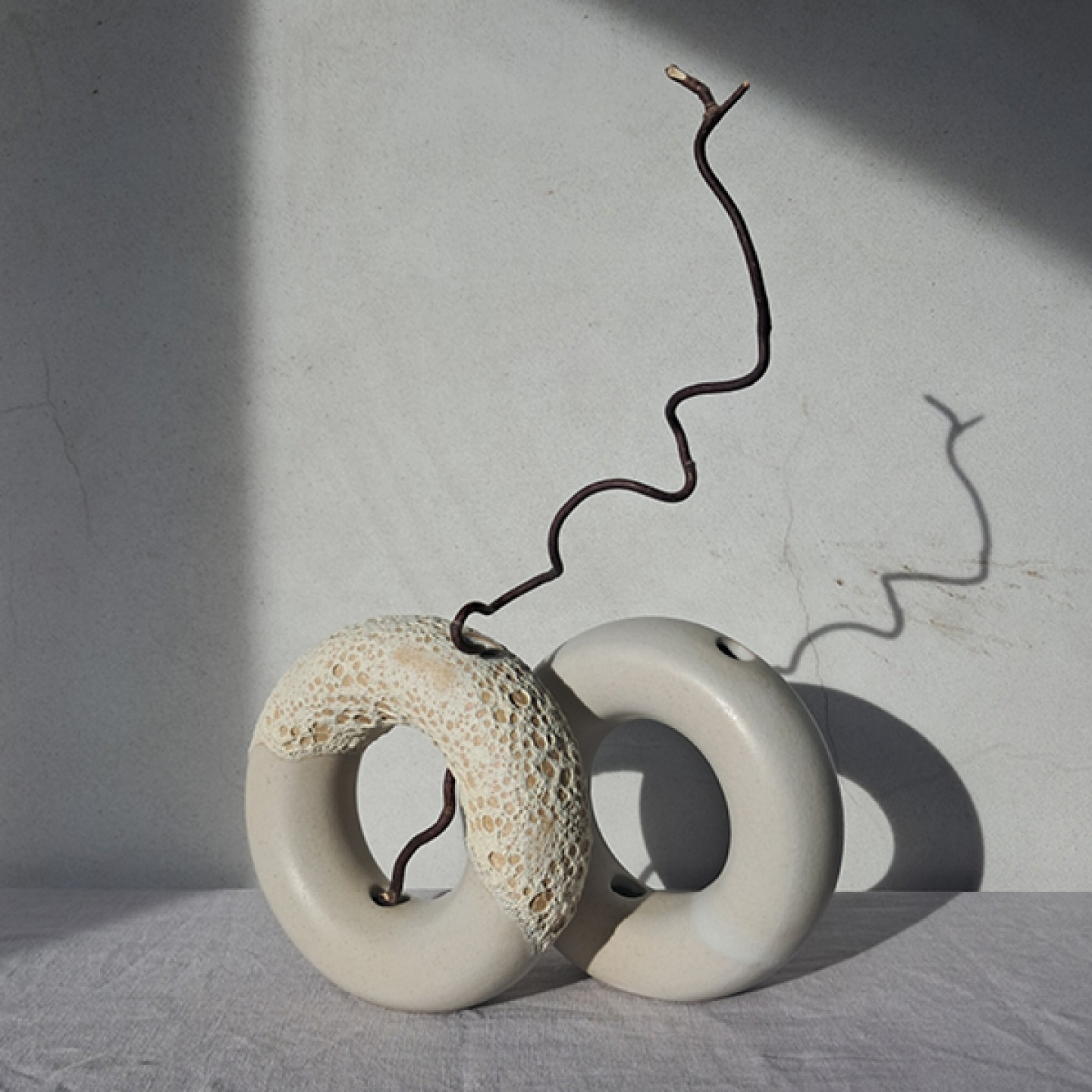 2 Circular sand coloured vase