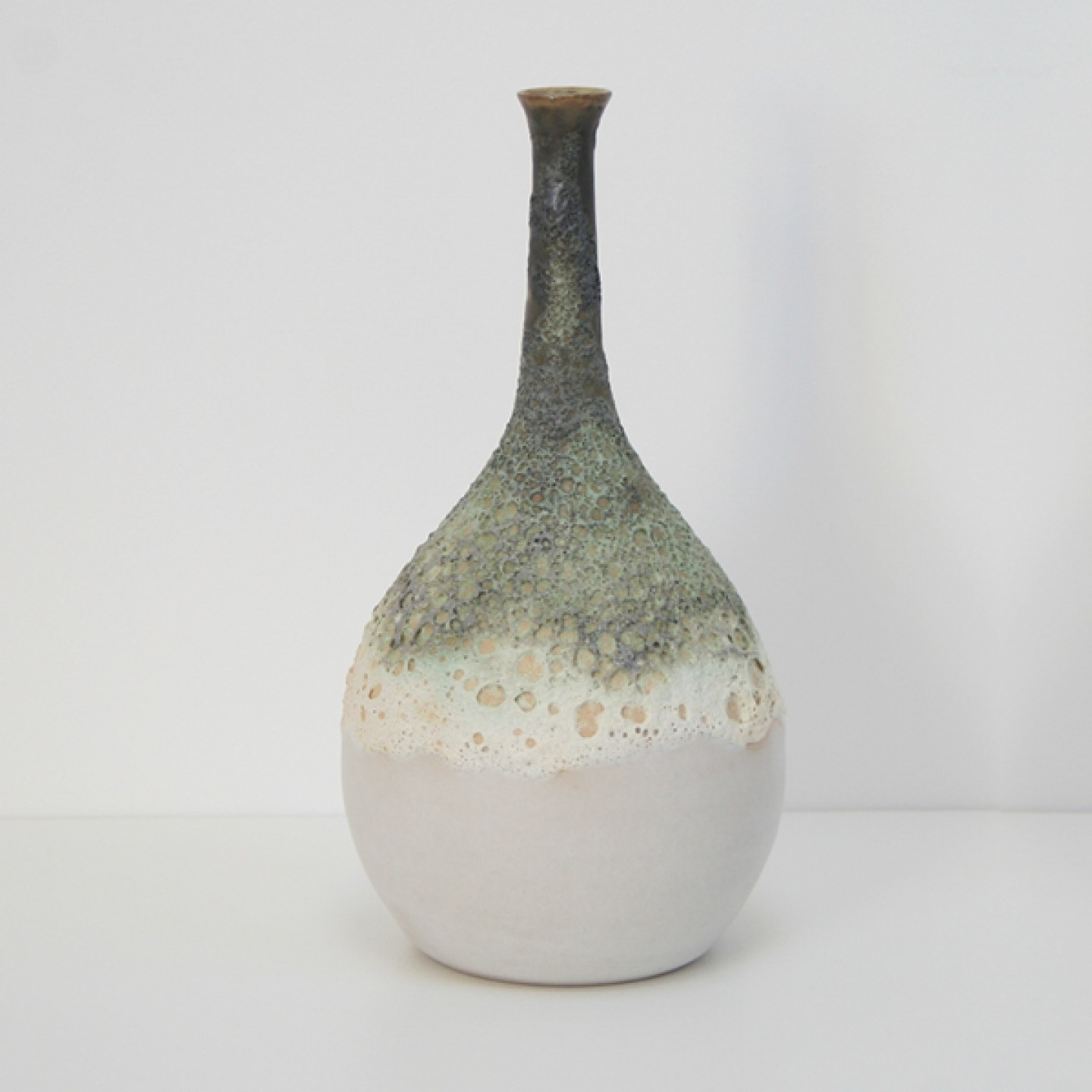 Round based funnel neck vase