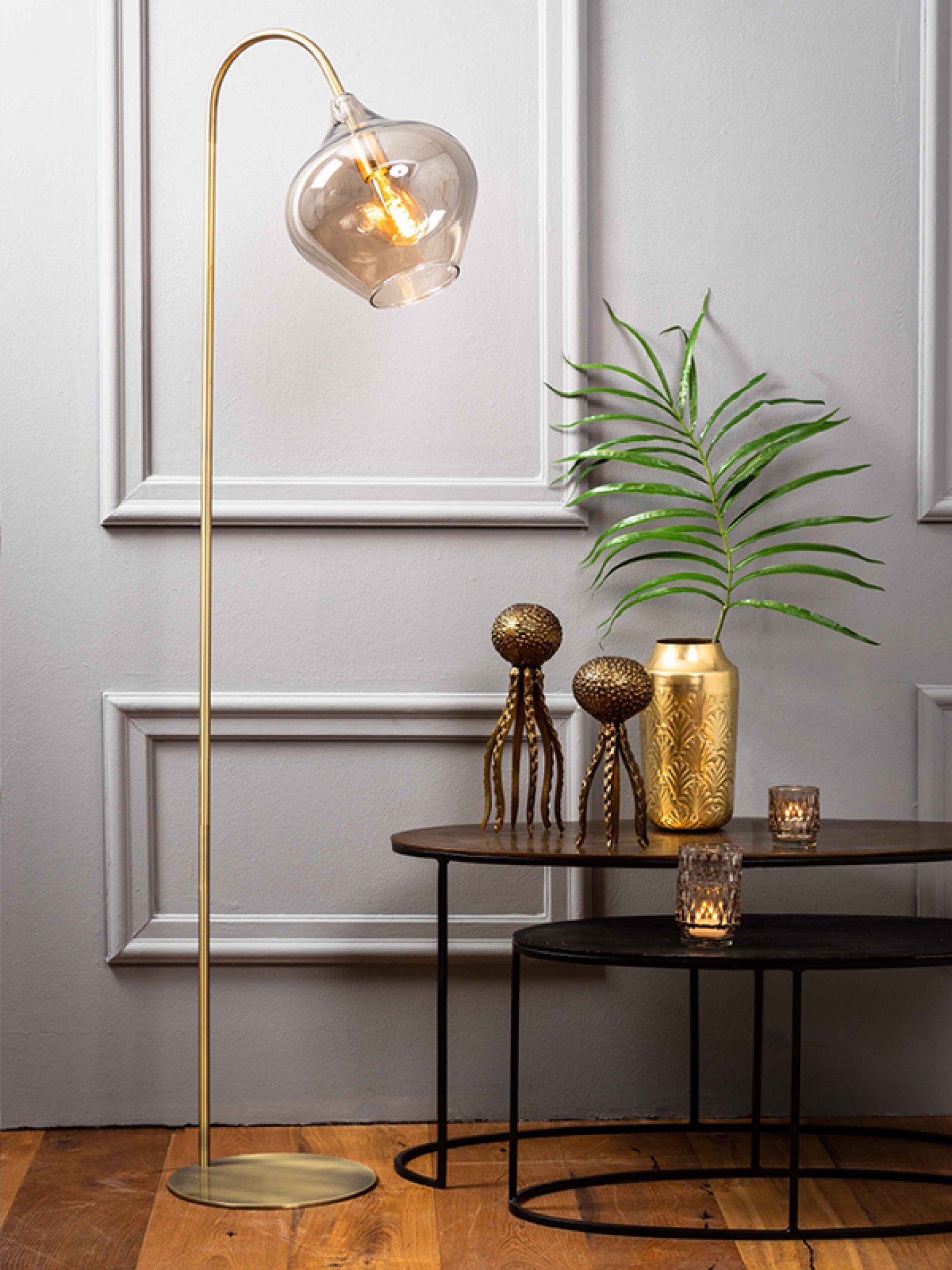 Rakel floor lamp with grey panelled wall and dark wood nest tables