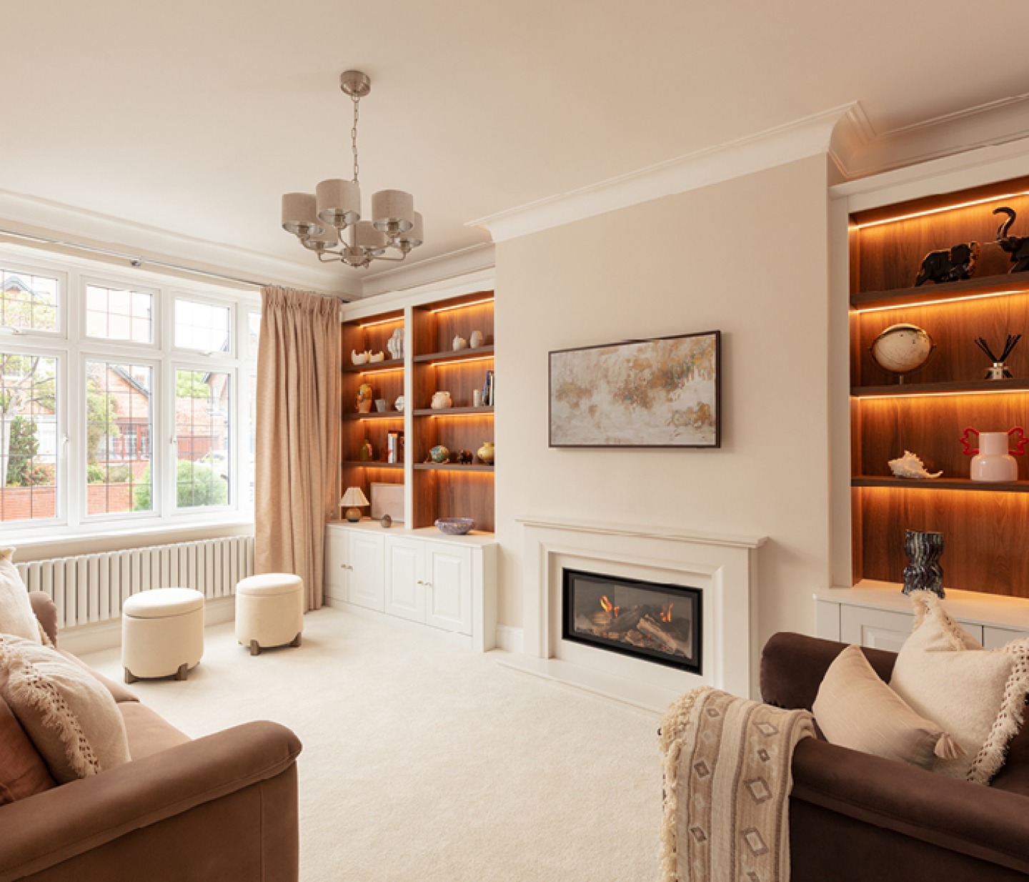 Modern lounge with built in shelving and cabinets