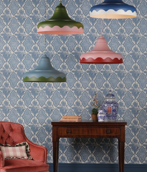 hand painted two-tone pendant lights hanging over side table and chair