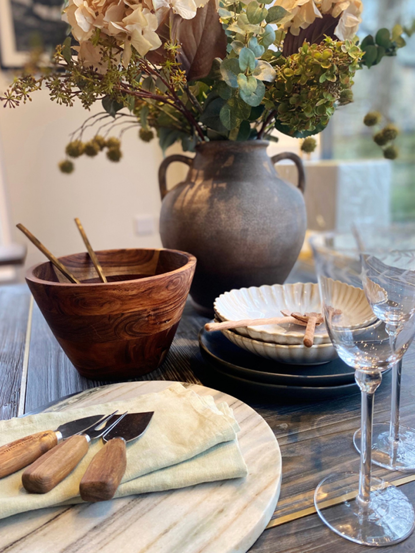 Table and Glassware styled on a wooden table with spring flowers