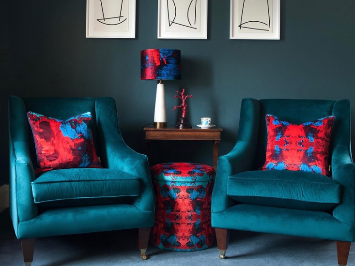 footstool and 2 chairs in a living room