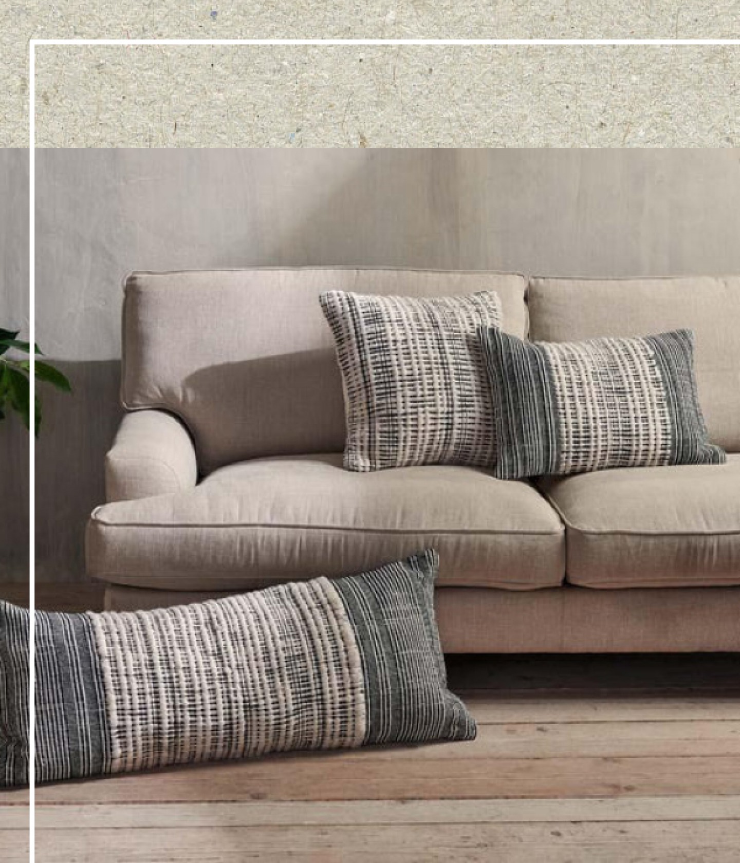 a sofa with 3 cushions on it