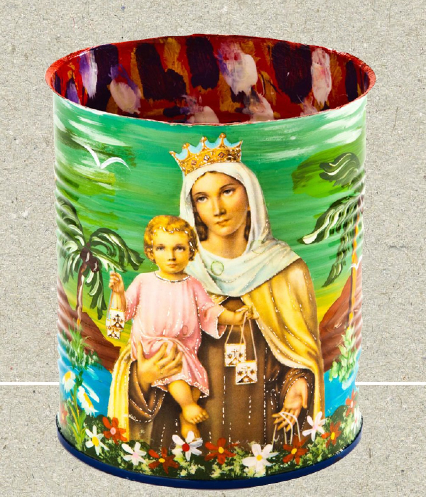 a recycled jar with a saint painted on it
