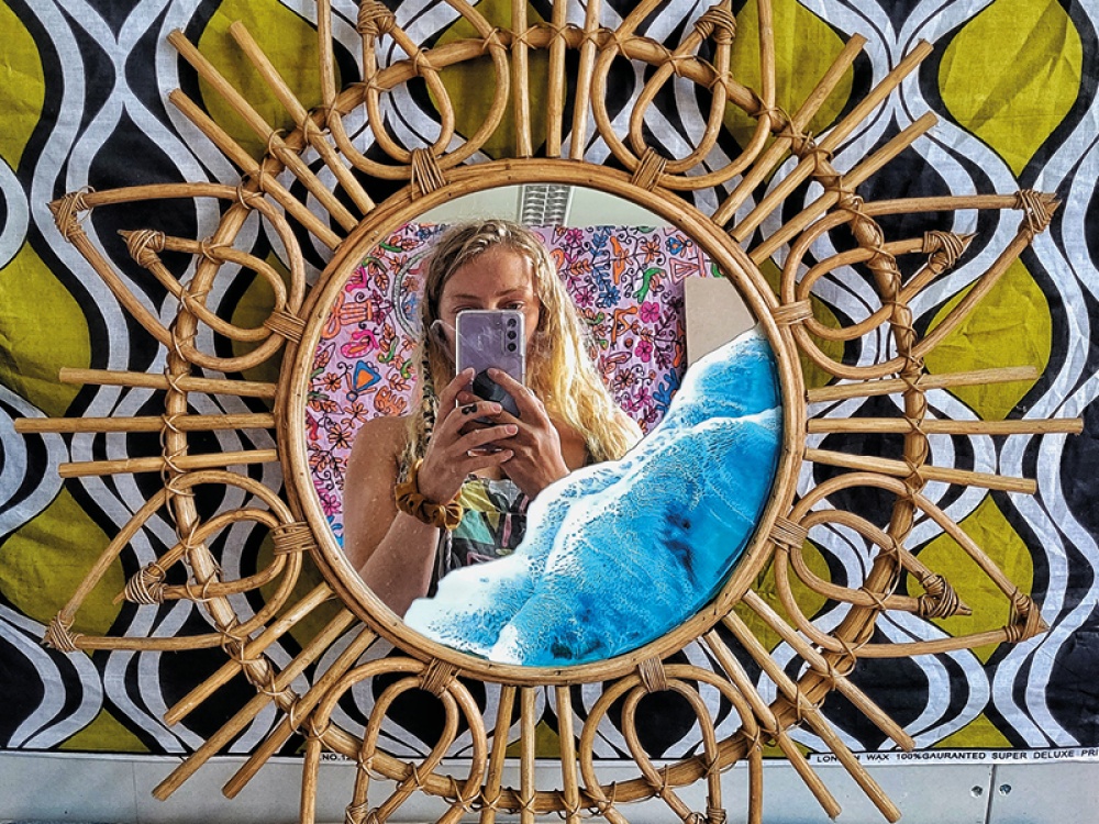girl taking picture in a mirror