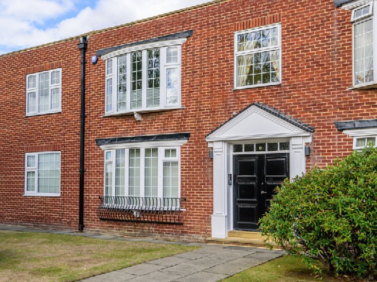 red brick house with a black door