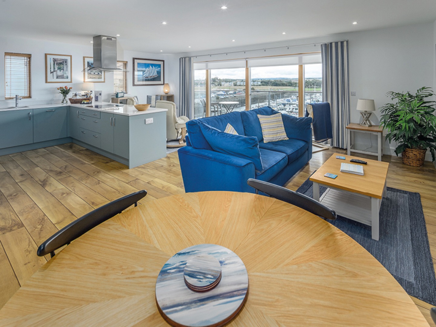 open plan dining, seating and kitchen area in Amble apartment