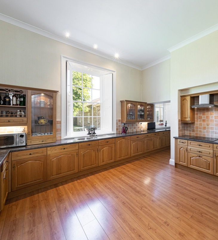 kitchen with wooden cupboard and floors