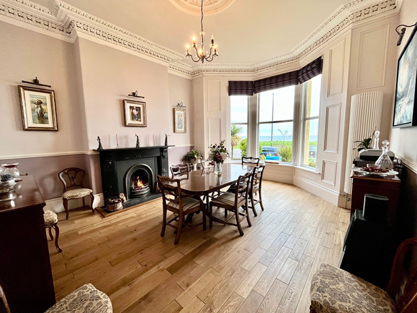 Dining room with high ceilings and period features