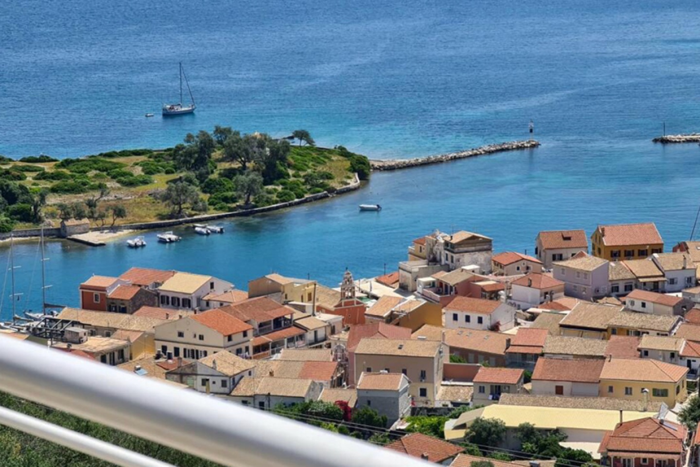View from balcony over roof tops and sea