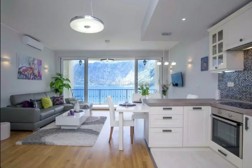 Contemporary oen-plan living and dining room with sea views and private balcony