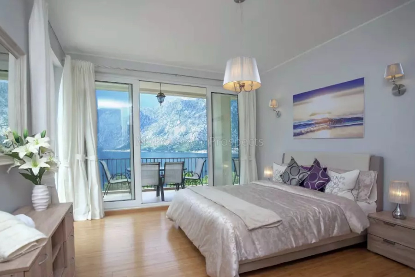 Light and modern bedroom withstanding sea views from a private balcony