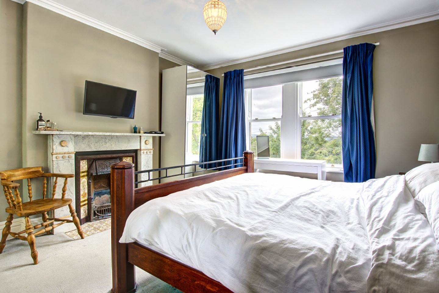 Double bedroom with fire place and period features