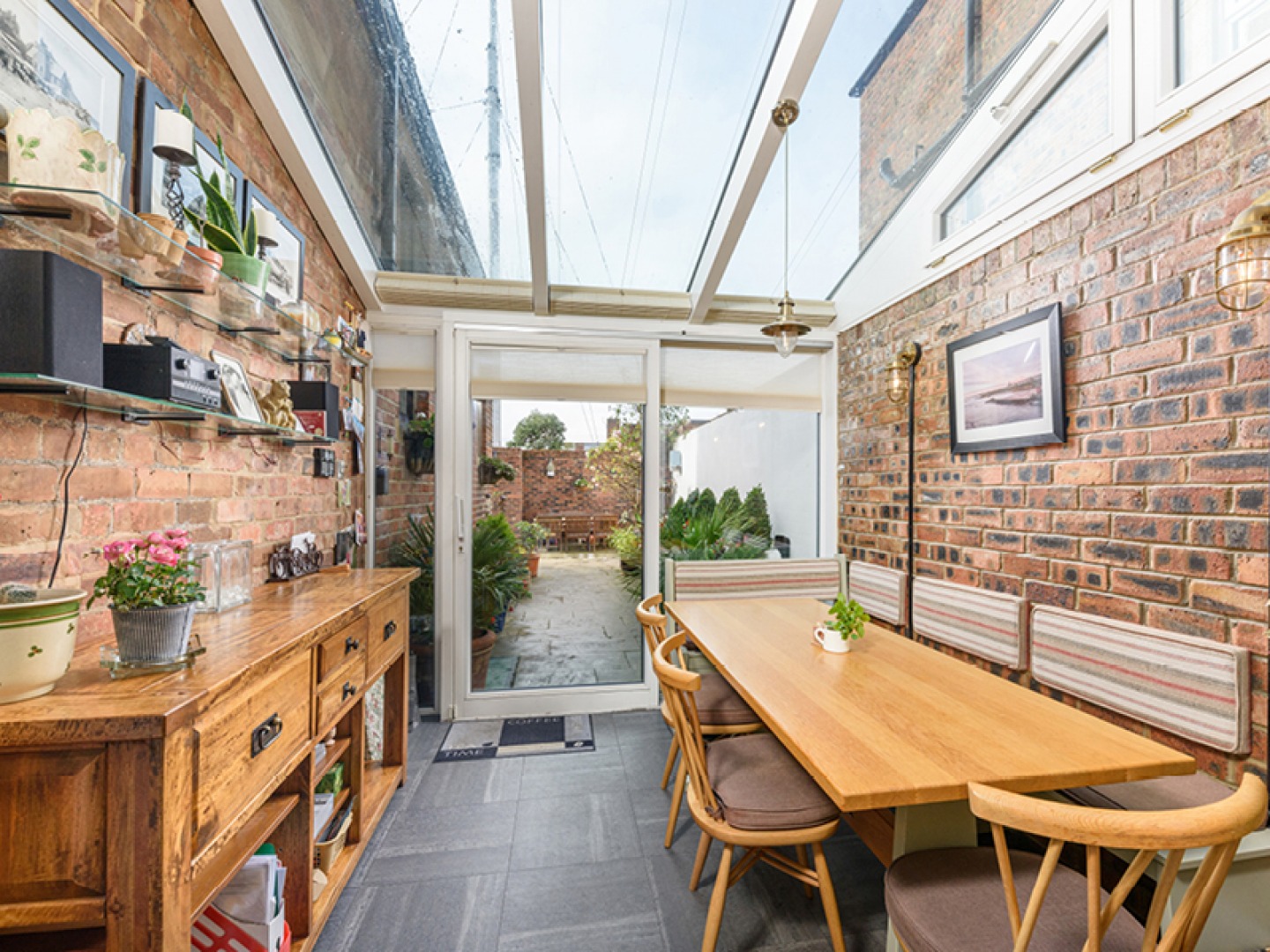 glass roofed dining area with patio doors