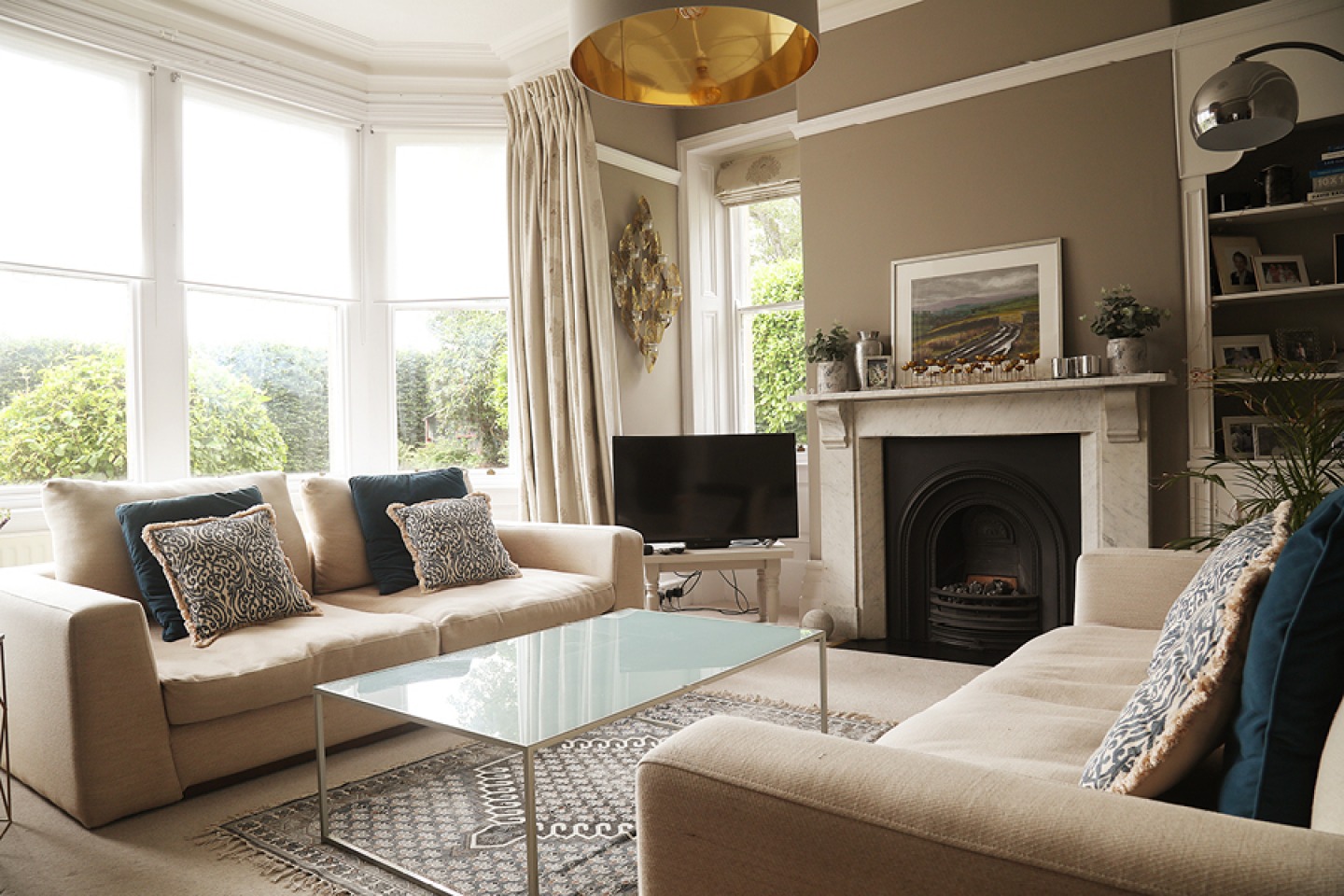 Neutral decor in a modern lounge with period features