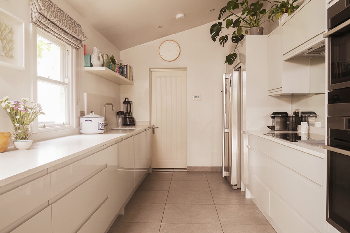 High gloss galley style kitchen