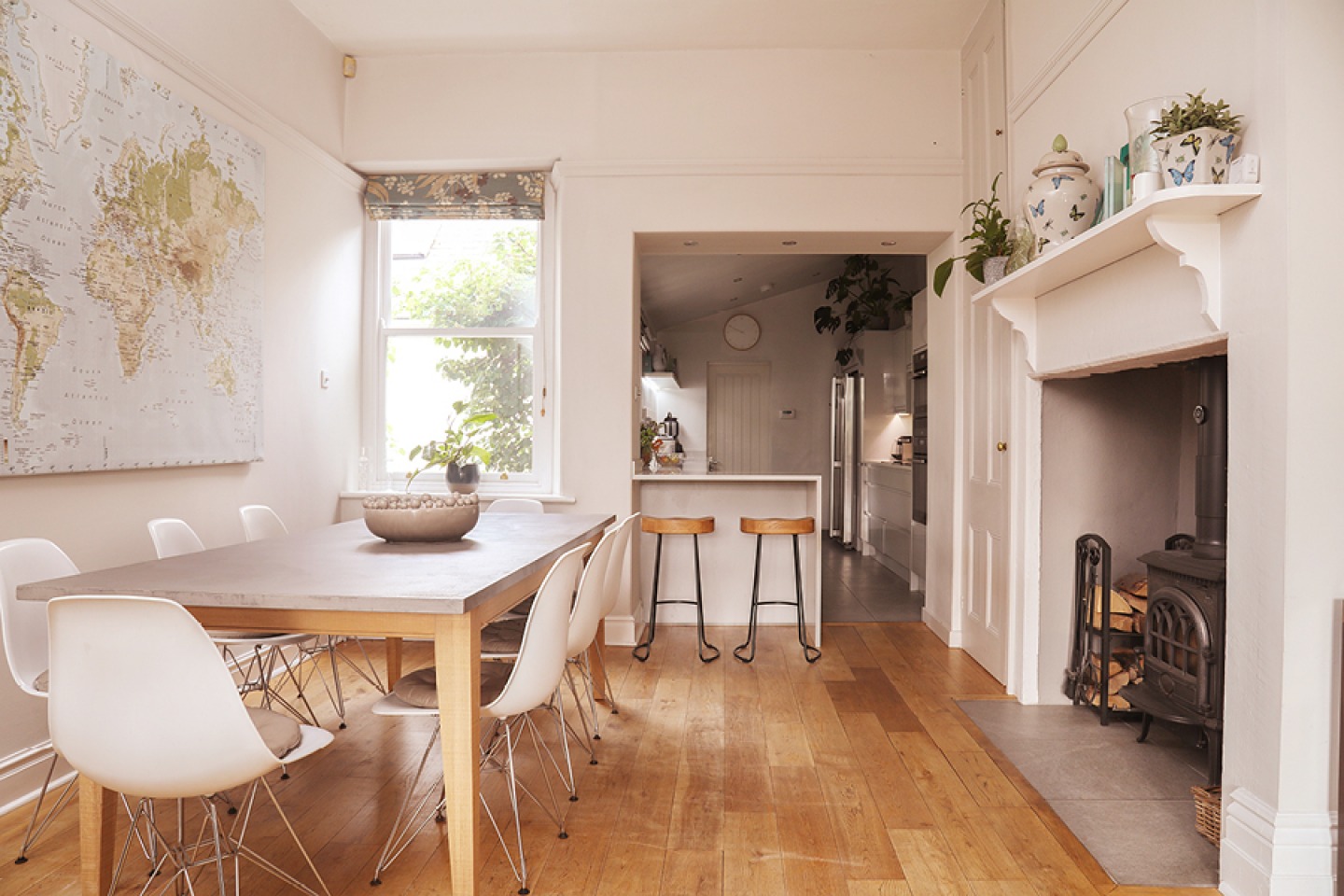 modern, light and airy dining room with feature fireplace