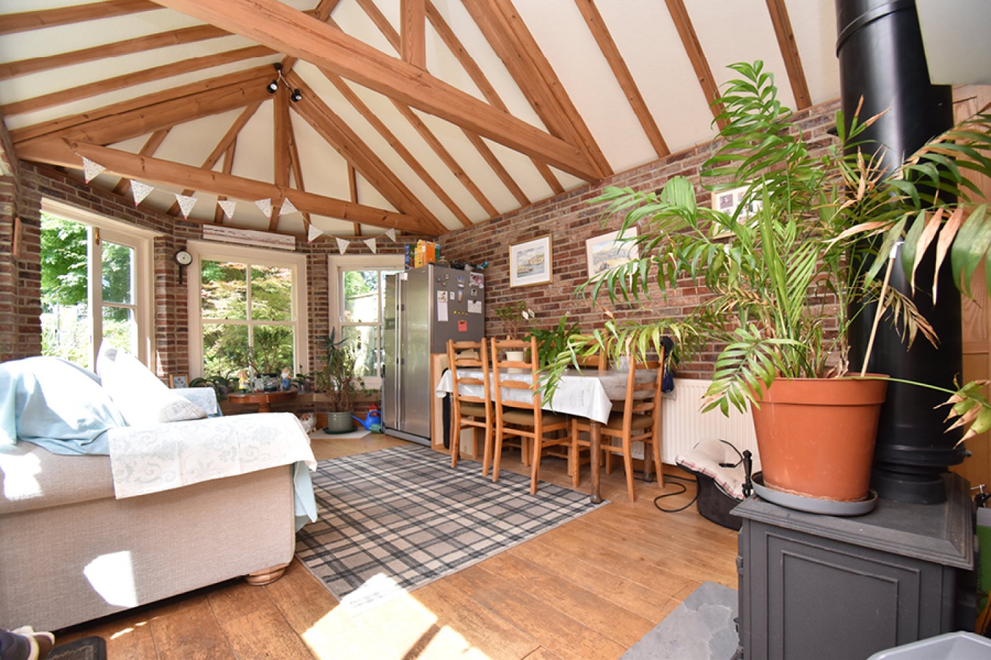 sun room with vaulted ceiling and exposed beams