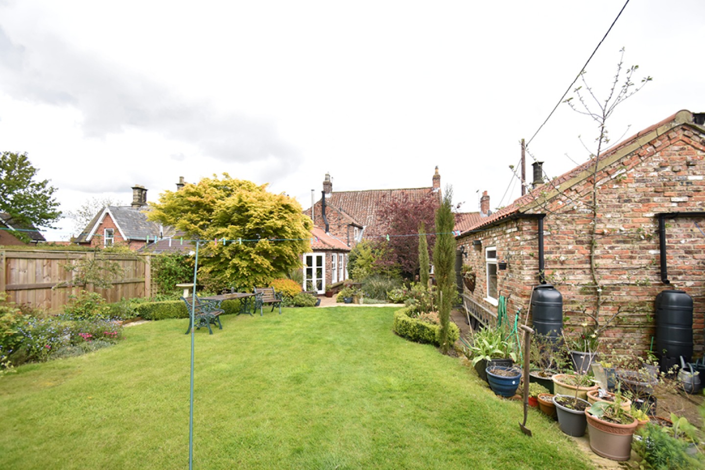View sown a lawned garden to the rear of the house