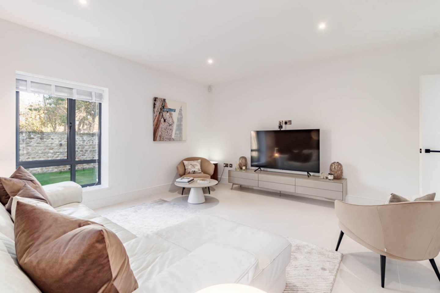All white living area with beige accessories