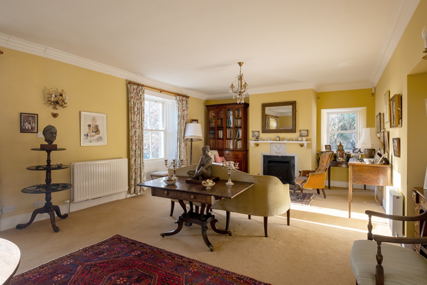 Yellow lounge with traditional decor