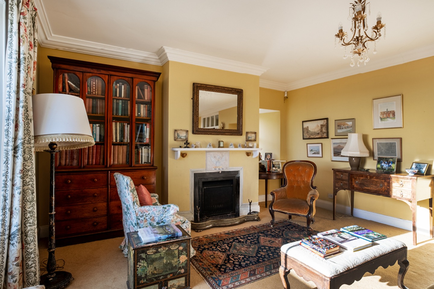 Yellow lounge with traditional decor