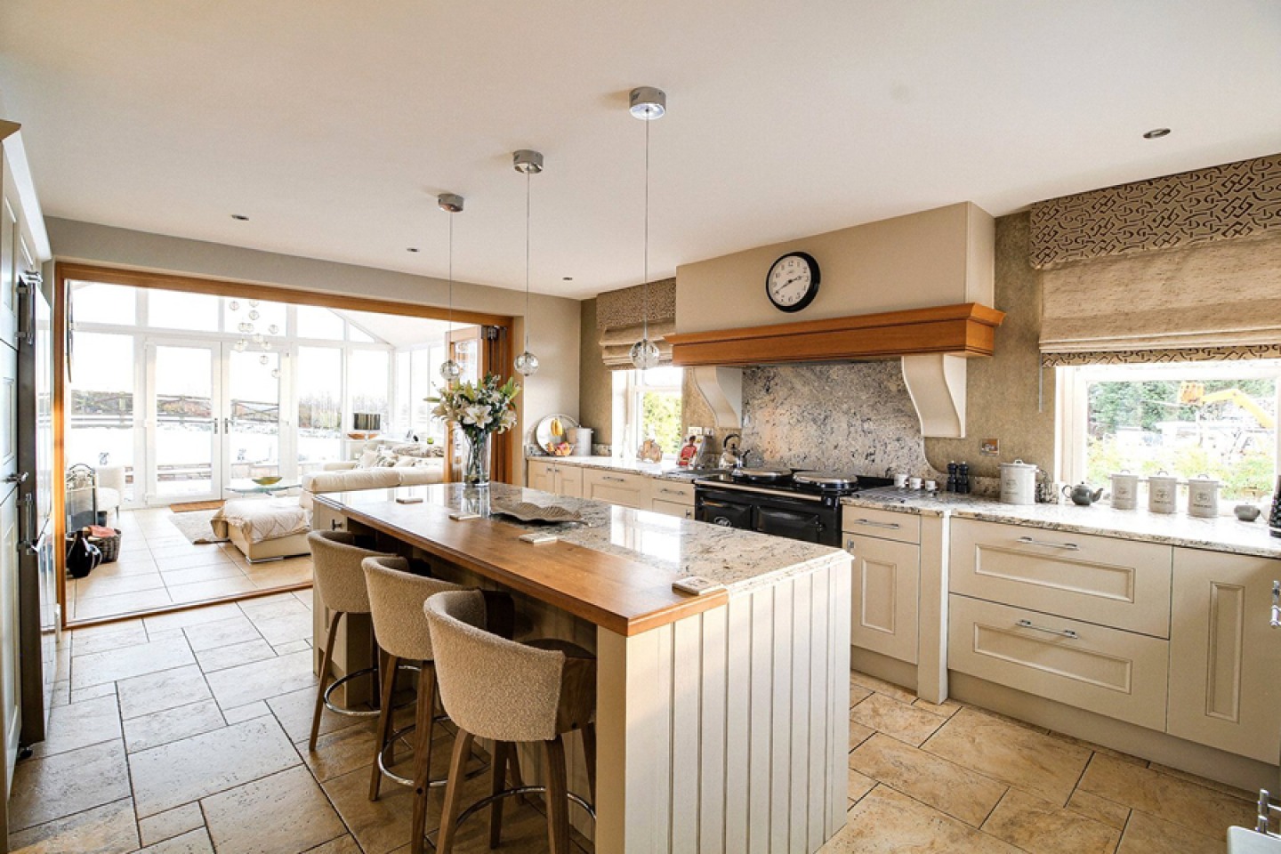 farmhouse style kitchen with sliding doors to garden room