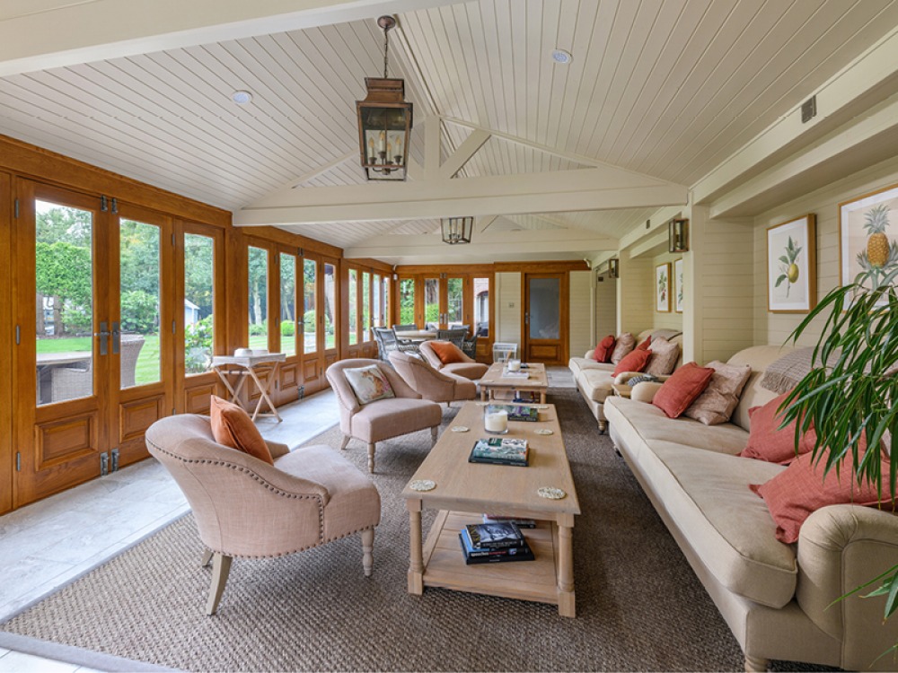 Modern summerhouse with neutral decor and comfy seating