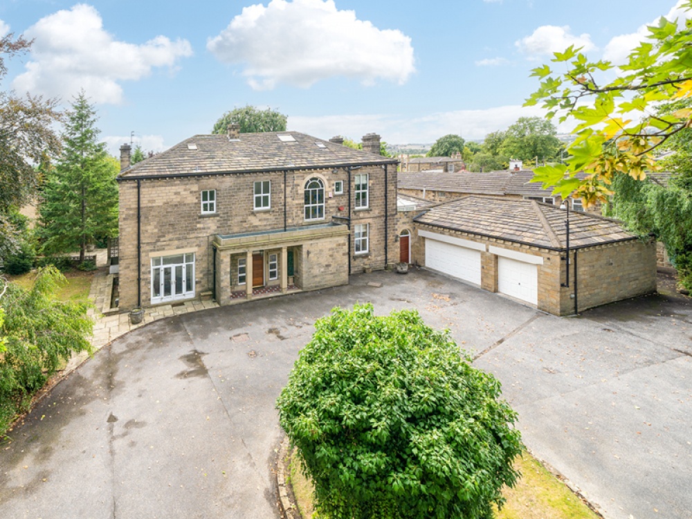 External shot of period property with expansive grounds