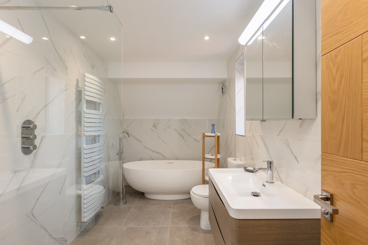 modern marble bathroom with free standing bath