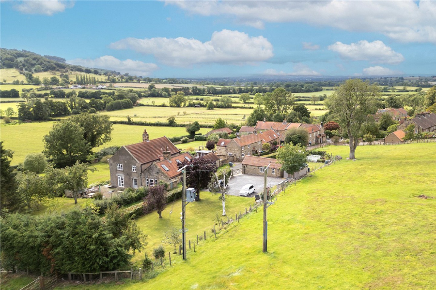 drone view over the property and surrounding fields