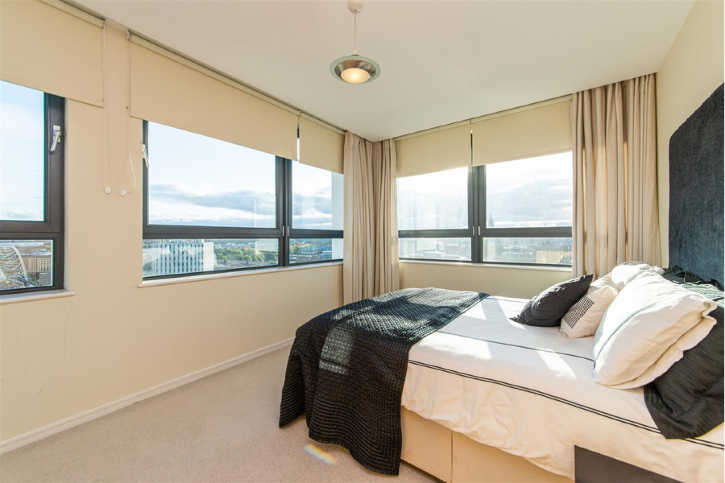 Large modern bedroom with views over the city of Newcastle