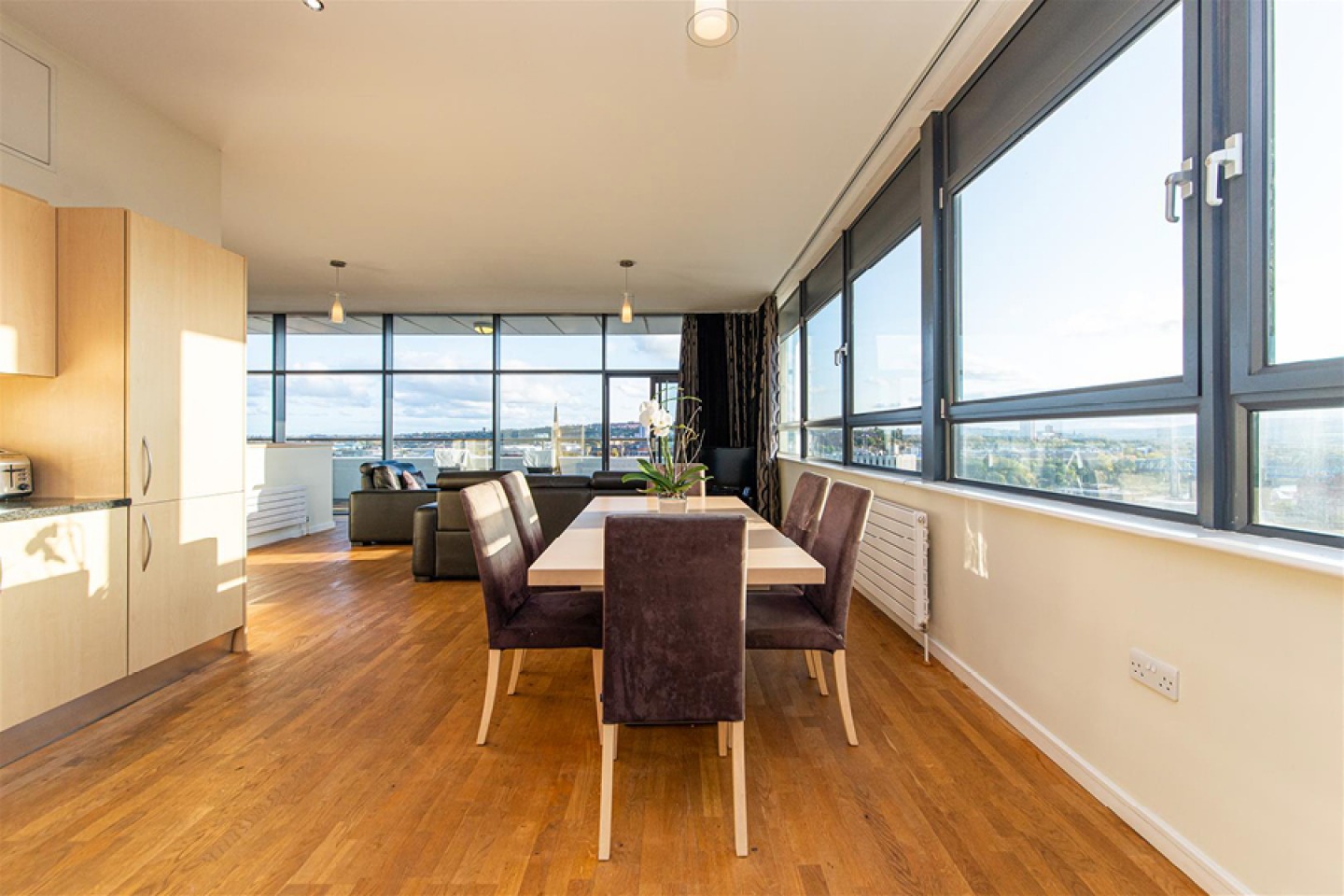 open plan dining area with large windows with views of Newcastle and Gateshead
