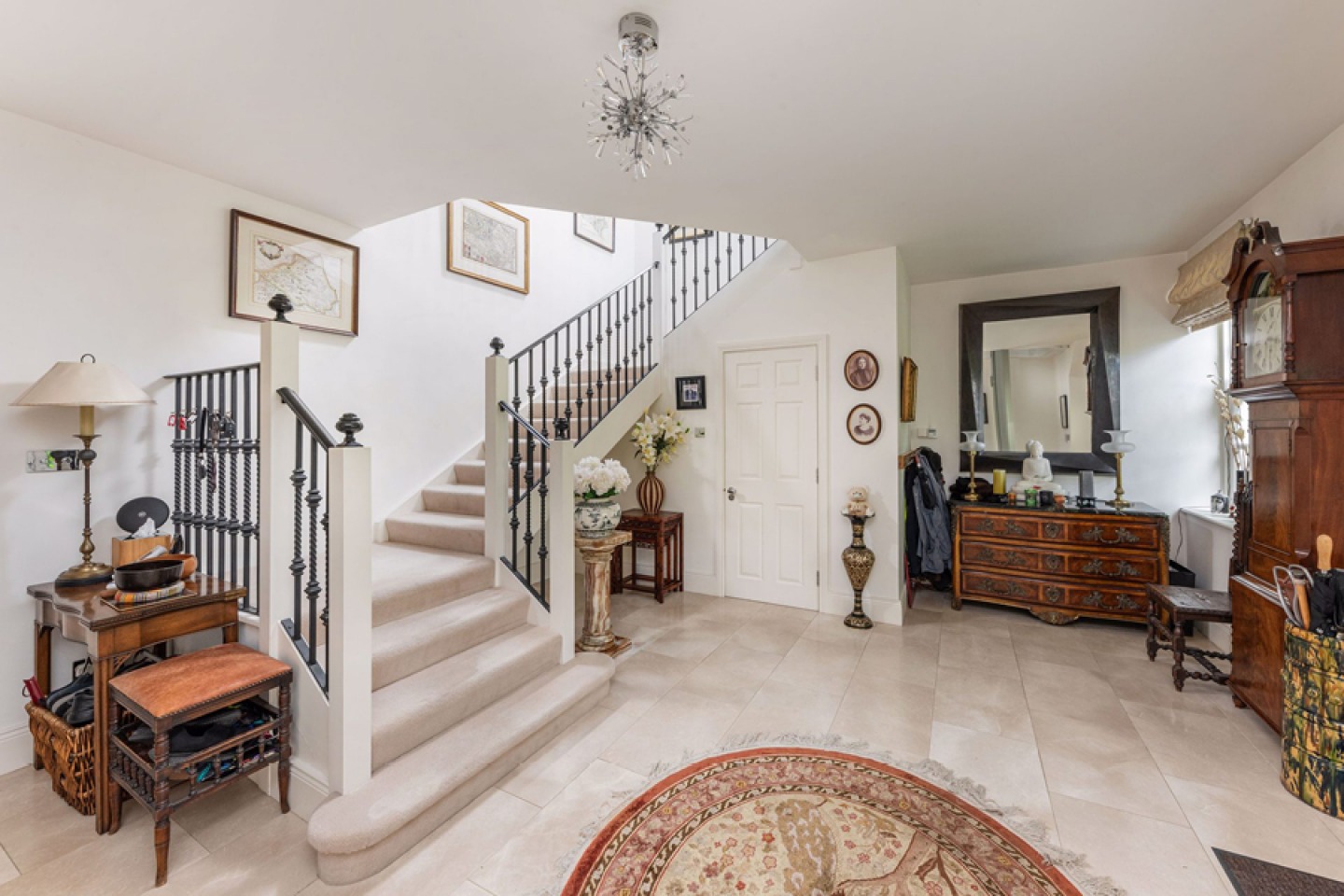 Large reception room with wide open staircase