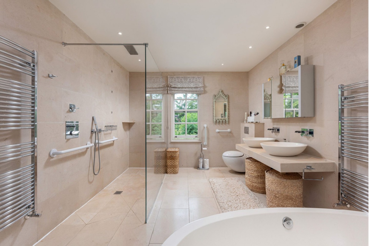 modern tiled bathroom with twin sinks and walk in shower