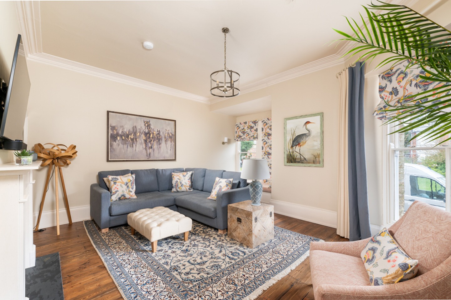 Traditional lounge with corner sofa and foot stool