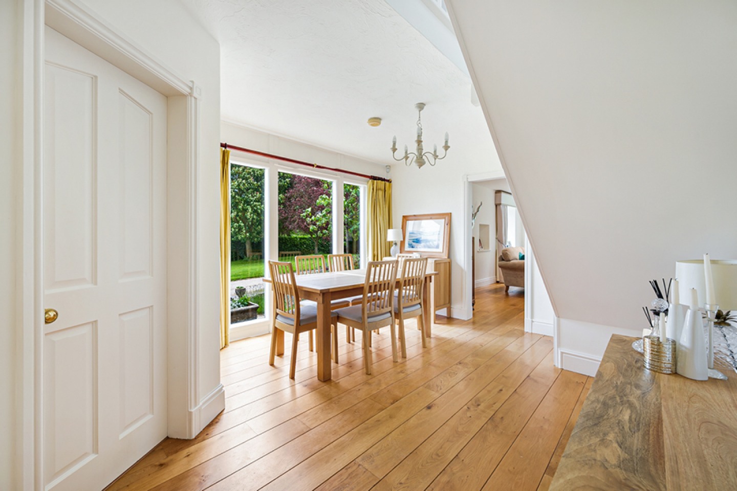 light airy dining room with full length glass doors