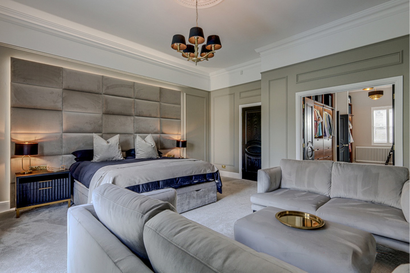 large master bedroom with lounge area