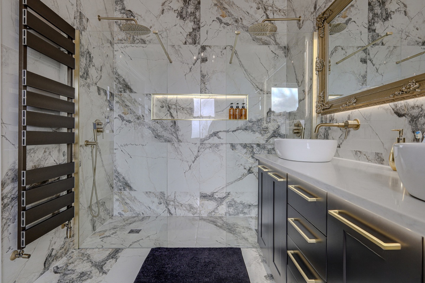 modern en-suite with walk in shower and twin sinks