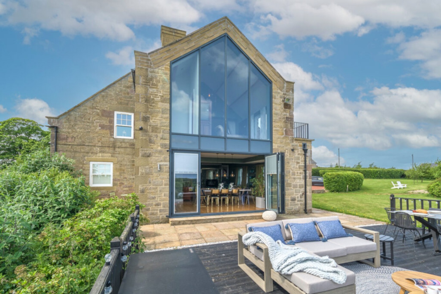 Large stone-built cottage with glass picture window and bi-folding doors below